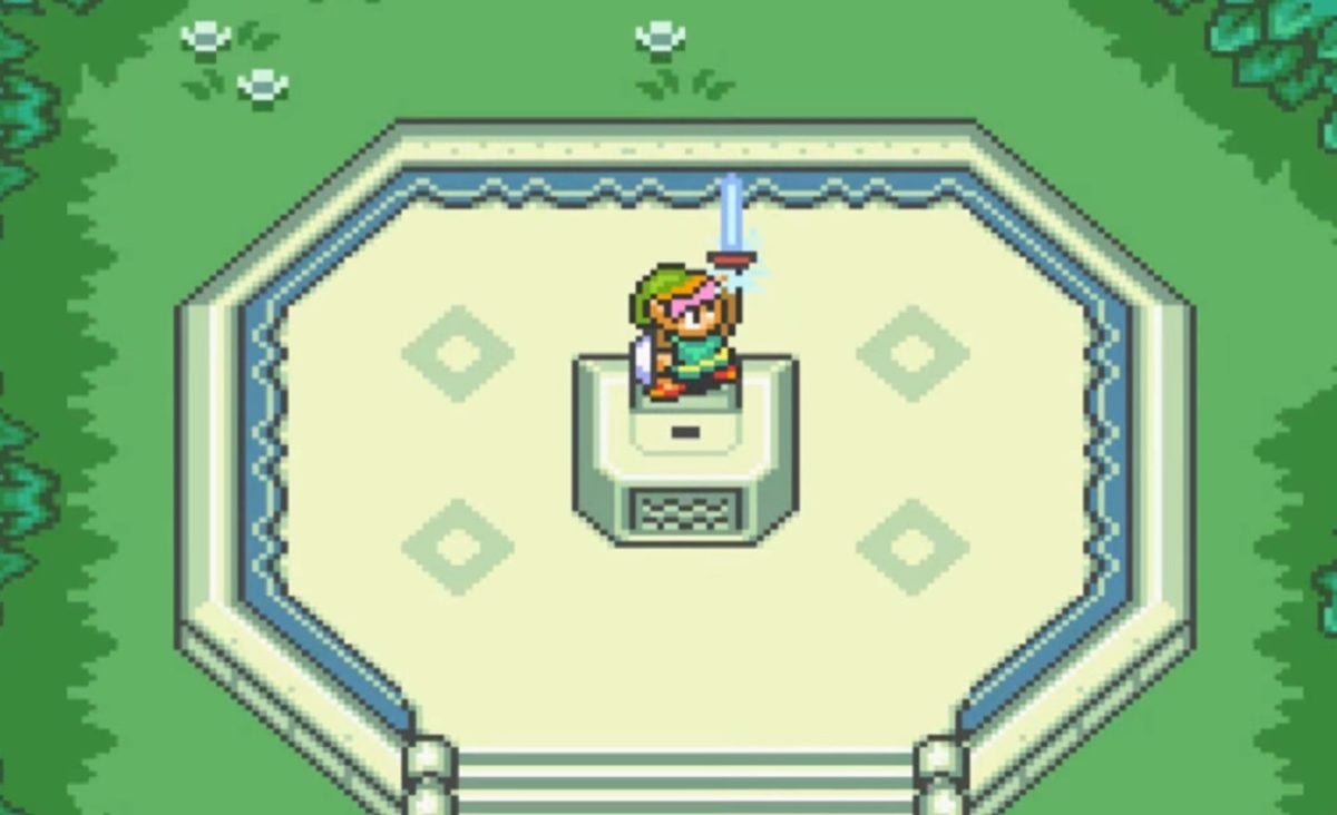 There is a shot of Link pulling the Master Sword from its stone. There is grass and tiles around him on the ground.